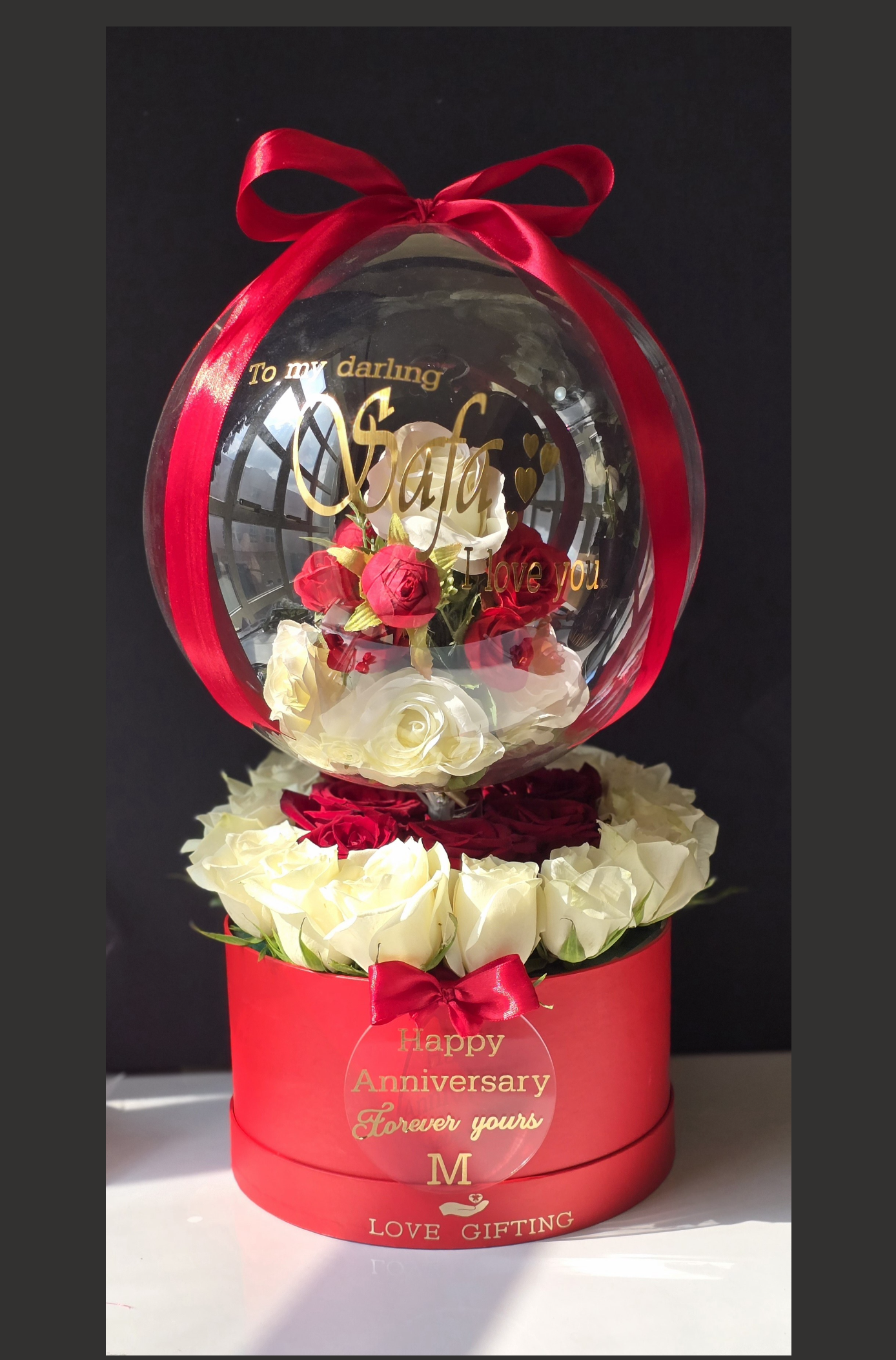Bubble balloon with faux and fresh roses arrangement 