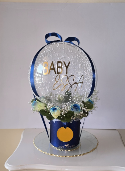 Baby boy balloon and flower arrangement.
